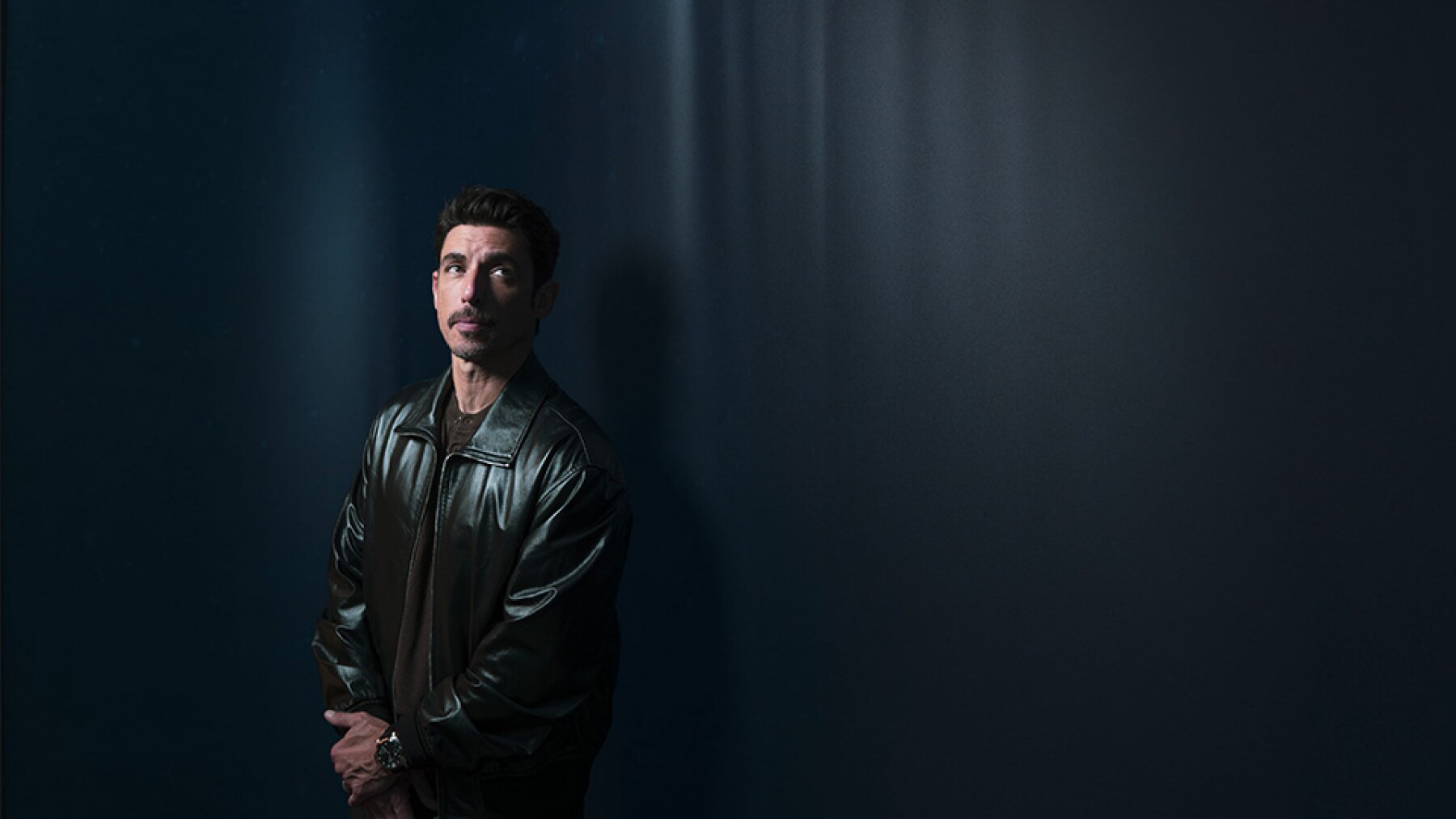 Alberto Guerra with dark background